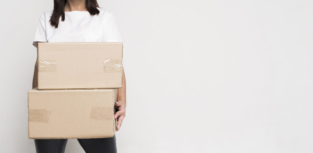 portrait beautiful woman holding boxes