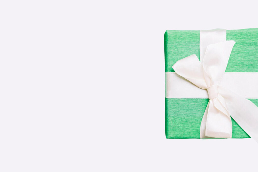 wrapped birthday present with white ribbon bow